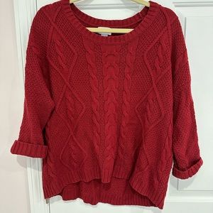 Red knit sweater with 3/4 sleeves